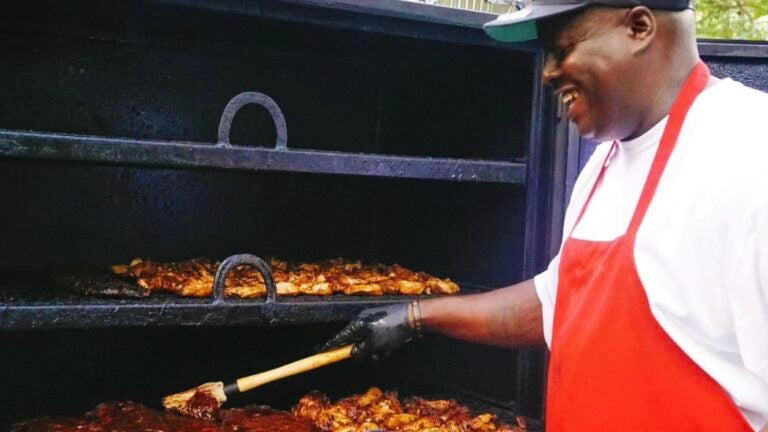 Chef David Wade cooking barbecue on a smoker.